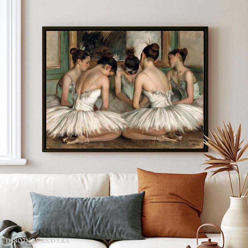 The image is a framed painting depicting a group of ballet dancers in white tutus and ballet slippers, arranged in a semi-circle on a stage.