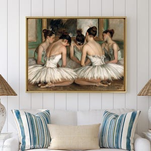 The image is a framed painting of five ballerinas in white tutus and green ballet slippers, depicted in a classical dance pose.