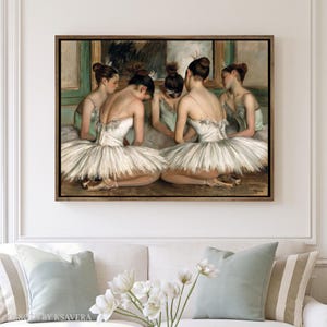 The image is a framed painting of ballet dancers in white tutus and ballet slippers, arranged in a group and facing each other.