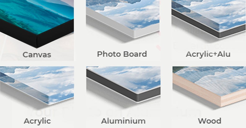 May include: Close-up of six different types of canvas prints, including canvas, photo board, acrylic+alu, acrylic, aluminum, and wood. Each print features a blue sky with white clouds.