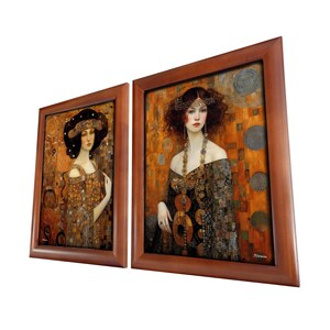 May include: Two framed paintings of women in gold and black dresses with intricate details. The paintings are set against a background of gold and brown mosaic tiles.