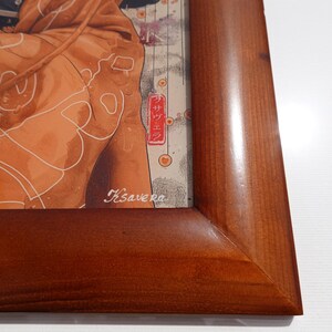 The image is a wooden frame with a picture of a person wearing a brown jacket.