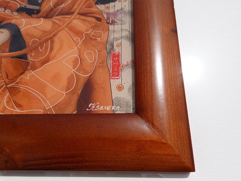 The image is a wooden frame with a picture of a person wearing a brown jacket.