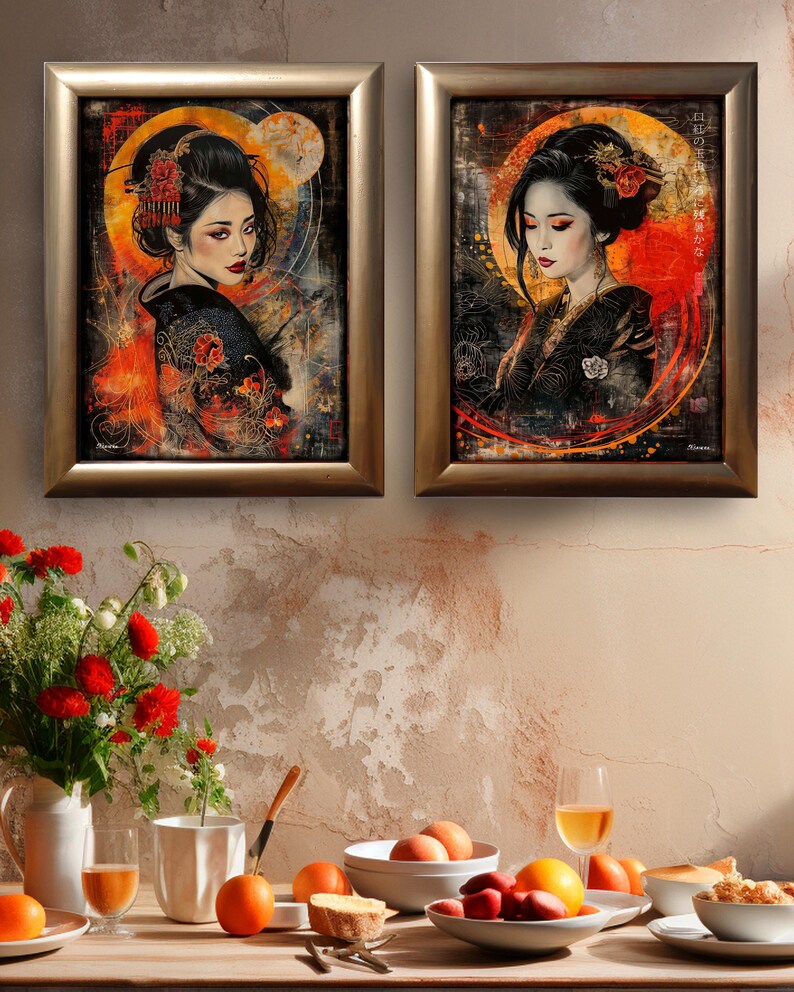 May include: Two framed art prints depicting portraits of women in traditional Japanese dress. The artwork has a dark background with a circular orange and yellow glow behind the subjects. The women have dark hair and wear black kimonos.