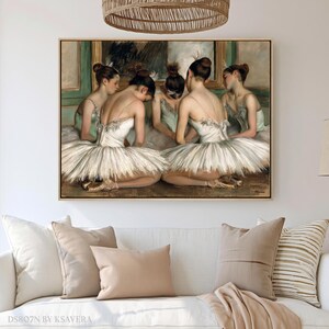 The image is a framed painting of ballet dancers in white tutus and ballet slippers, arranged in a group and facing a mirror.