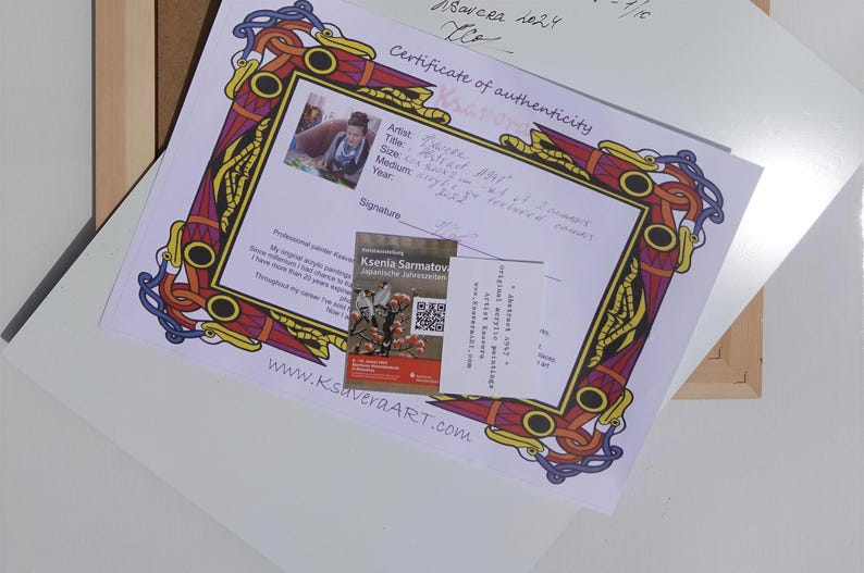 a certificate of authenticity for a painting, with a colorful frame surrounding it. The certificate appears to be from a professional painter, and there is a QR code on the bottom right of the frame.