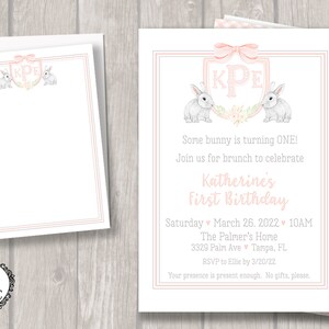 May include: Pink and white first birthday party invitation with a bunny rabbit theme. The invitation features a pink and white gingham pattern, a pink and white monogram with the initials "KPE", and two bunny rabbits. The text on the invitation reads "Some bunny is turning ONE! Join us for brunch to celebrate Katherine's First Birthday. Saturday March 26, 2022 10AM The Palmer's Home 3329 Palm Ave Tampa, FL RSVP to Ellie by 3/20/22 Your presence is present enough. No gifts, please."