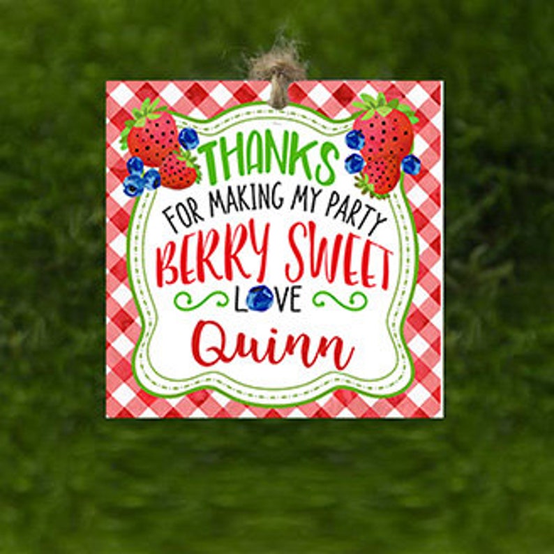 May include: Red and white checkered thank you tag with a white border. The tag features a strawberry and blueberry design with the text "Thanks for making my party berry sweet love Quinn".