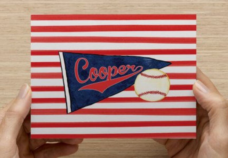 May include: A red, white, and blue striped background with a blue pennant that says "Cooper" in red lettering. A baseball is in the lower right corner of the image.