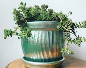 green and mercury glass like upcycled repurposed boho planter with attached drainage plate