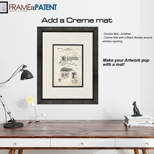 May include: A black framed print of a vintage guitar patent drawing with a creme mat and a black border around the window opening. The text "Add a Creme mat" and "Make your Artwork pop with a mat!" is visible in the image.
