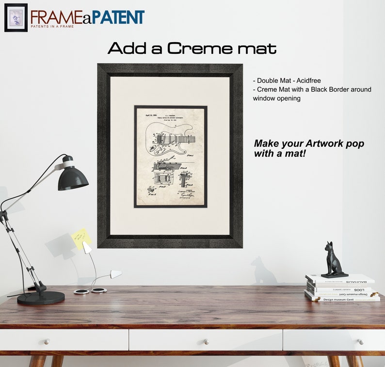 May include: A black framed print of a vintage guitar patent drawing with a creme mat and a black border around the window opening. The text "Add a Creme mat" and "Make your Artwork pop with a mat!" is visible in the image.