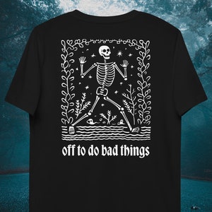 May include: Black t-shirt with a white graphic of a skeleton walking through a forest with the text "off to do bad things" underneath.