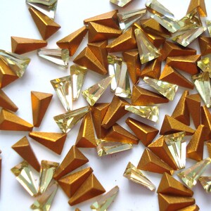 12pc 3.8x2.2x.4mm Swarovski Jonquil Yellow Tapered Baguettes, Gold Foiled