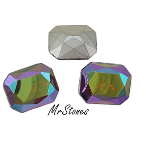 May include: Three faceted, rectangular gemstones. Two are iridescent with purple, green, and gold hues. The third is a solid gray color. The text "MrStones" is in the lower right corner.