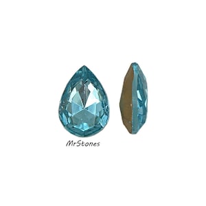May include: Two aquamarine-colored, teardrop-shaped gemstones. One is viewed from the front, showcasing its faceted surface, while the other is seen from the side, revealing its shape and color. The text "MrStones" is visible.