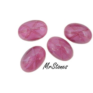 May include: Four pink oval-shaped glass stones with a white swirl pattern. The stones are smooth and shiny.