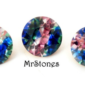 May include: Three round, faceted gemstones with a pink, blue, and green iridescent color pattern. The gemstones are approximately 1 cm in diameter.