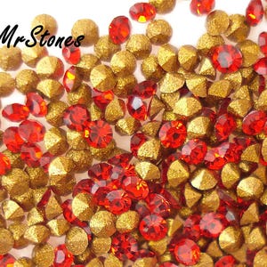 May include: A close-up shot of a mix of red and gold gemstones. The red stones are faceted, while the gold ones have a textured, geometric surface. The Mr. Stones logo is visible in the top left corner.