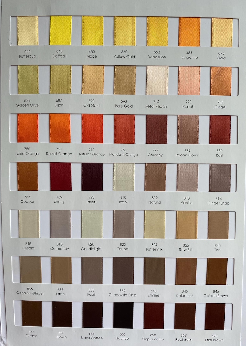 May include: Colour chart displaying ribbon swatches in a range of hues, including yellow, orange, brown, and neutral shades. Each colour is labelled with a name and number, providing a diverse palette for craft and design work.