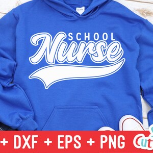 May include: A royal blue hoodie with a white graphic that says "School Nurse" in a varsity-style font with a white baseball-style arc underneath.