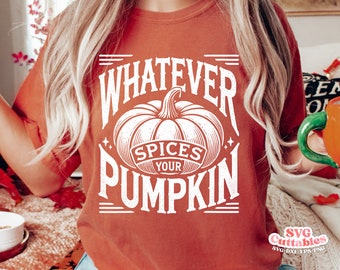 May include: A rust-colored t-shirt with a white graphic design featuring a pumpkin with the text "Whatever Spices Your Pumpkin".