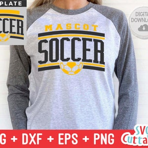 May include: A grey and black baseball jersey with the words "MASCOT SOCCER" in black and yellow lettering. A football is centred below the text. The words "SOCCER" are also displayed in a separate box at the top of the image.