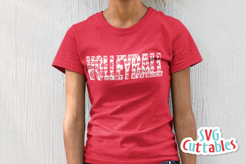 May include: Red t-shirt with white text that reads "VOLLEYBALL" with other volleyball terms surrounding the word. The text is in a block style font.