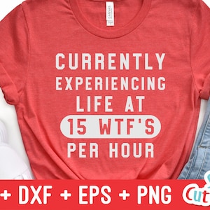 May include: Red t-shirt with white text that reads "Currently experiencing life at 15 WTF's per hour".