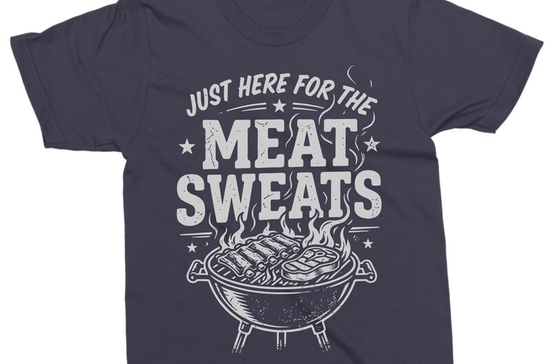 May include: Dark navy blue t-shirt with the text "JUST HERE FOR THE MEAT SWEATS" in white. The graphic includes a grill with ribs and a steak, flames, and stars.