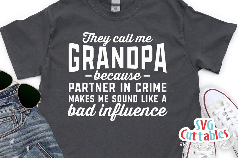 May include: A dark gray t-shirt with white text that reads "They call me GRANDPA -because- PARTNER IN CRIME MAKES ME SOUND LIKE A bad influence".