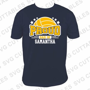 May include: A navy blue t-shirt with a white graphic of a volleyball and the text "Proud Dad of Samantha".