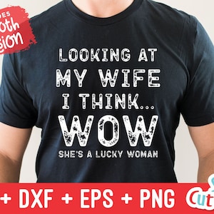 May include: A black t-shirt with white text that reads "Looking at my wife I think... WOW She's a lucky woman".