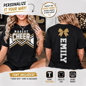 May include: A black t-shirt featuring a front graphic with the text MASCOT CHEER in white and gold, and a back graphic with a gold bow icon above the vertical white text EMILY. The design includes geometric chevron patterns in white and gold.