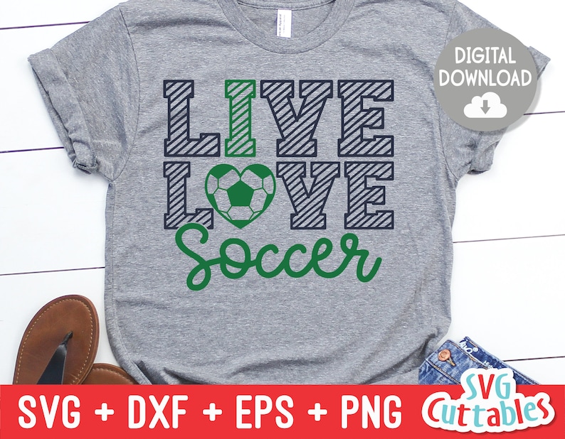 May include: A gray t-shirt with the text "I LIVE LOVE Soccer" in green and blue. The "I" is a green soccer ball with black stitching.