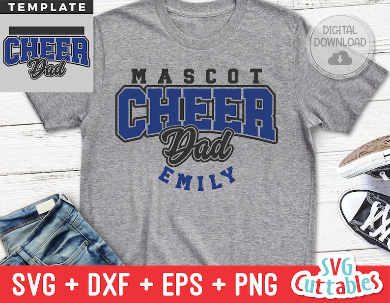 K&ouml;nnte beinhalten: Ein graues T-Shirt mit einem blauen und schwarzen Design, auf dem "Mascot Cheer Dad Emily" steht.