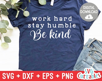 May include: A navy blue t-shirt with the text "work hard stay humble Be kind" in white lettering.