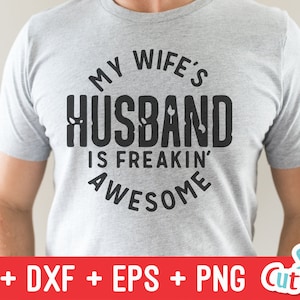 May include: A gray t-shirt with a black circle design that says "My wife's husband is freakin' awesome".