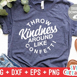 May include: A blue t-shirt with white text that reads "Throw Kindness Around Like Confetti".