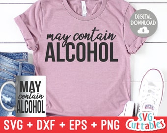May include: A pink t-shirt with the text "may contain ALCOHOL" in black lettering. The shirt is on a white wooden background with a mug that says "MAY contain ALCOHOL" and a pair of white sneakers.