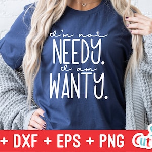 May include: A navy blue t-shirt with white text that reads "I'm not needy. I am wanty."