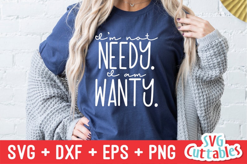 May include: A navy blue t-shirt with white text that reads "I'm not needy. I am wanty."