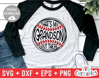 May include: A white and black baseball-themed design with the text "That's My Grandson Out There". The design is on a white t-shirt with black sleeves.