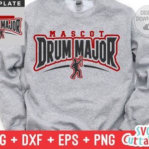 May include: A gray sweatshirt with the text "MASCOT DRUM MAJOR" in black and red lettering. A silhouette of a person holding a baton is in the center of the text.