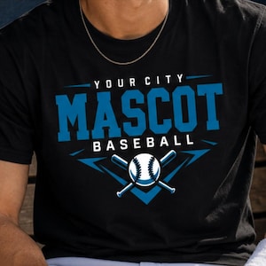 May include: A black short-sleeved t-shirt featuring a blue and white graphic print that reads YOUR CITY MASCOT BASEBALL, accompanied by an illustration of a baseball and two crossed baseball bats centered below the text in a chevron shape.