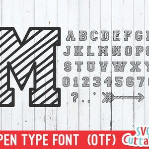 May include: A black and white striped font with uppercase letters, numbers, and punctuation marks. The font is in a bold, blocky style. The text "OPEN TYPE FONT (OTF)" is below the font.