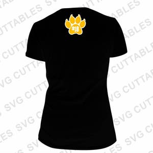 May include: Black t-shirt with a yellow paw print and the number 18 inside.