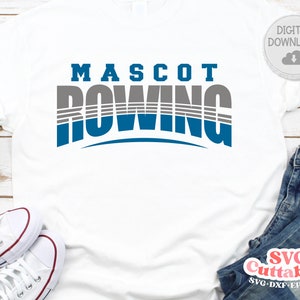 May include: A white t-shirt with a blue and gray graphic that says "MASCOT ROWING".