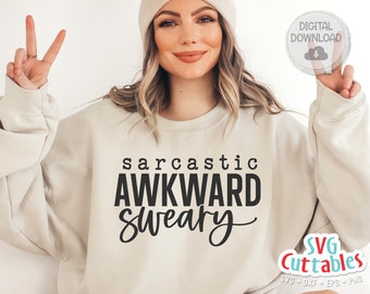 May include: A beige sweatshirt with the text "sarcastic awkward sweary" printed in black.