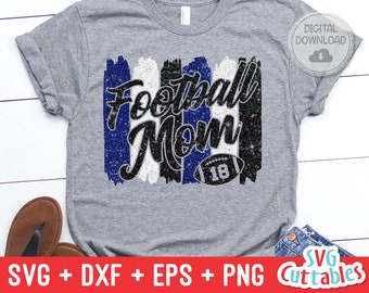 May include: A gray t-shirt with a black and blue glitter design that says "Football Mom" with a football graphic. The design includes a white stripe and a black stripe.